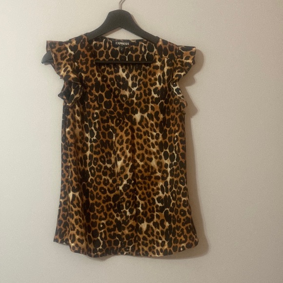 Express Tops - Express leopard sleeveless top. Black and brown cheetah print. Ruffle at sleeve.